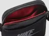 Close-up view of an open black Nike bag with a red interior. Produktbild-Vorschau