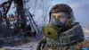 A person wearing a gas mask and protective gear in a post-apocalyptic setting. Produktbild-Vorschau