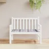 A white garden bench with a grey plaid cushion is shown against a light grey wall. Produktbild-Vorschau