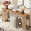 A console table with decorative items placed on it, next to a sofa and an ottoman, in a well-lit room. Produktbild-Vorschau