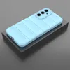 A light blue phone case with a ribbed texture is displayed on a dark gray block against a gray background. Produktbild-Vorschau