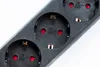 A close-up view of a black power strip with three outlets. Produktbild-Vorschau