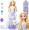 A doll of Elsa from Frozen with accessories, and a close-up of her face, with packaging in the background. Náhľad obrázku produktu