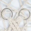 A close-up view of two silver rings attached to a macrame net made of beige rope. Podgląd zdjęcia produktu