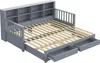A gray daybed with its mattress slats extended, showing storage drawers underneath and a bookshelf headboard. Náhled obrázku produktu
