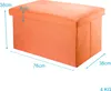 An orange storage ottoman with dimensions indicated by text overlays. Anteprima dell’immagine prodotto