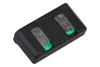 A close-up, top-down view of a black battery holder with two silver batteries inserted. Produktbild-Vorschau