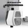 A white and black DC booster pump is shown in a bathroom setting. Náhled obrázku produktu