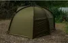 A green fishing tent set up on the ground next to a body of water. Anteprima dell’immagine prodotto