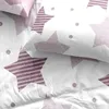 A close-up view of bedding with a star pattern. Produktbild-Vorschau