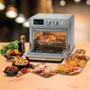 An air fryer oven is shown on a wooden table, surrounded by various fried foods and pizzas. Podgląd zdjęcia produktu
