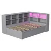 A gray bed frame with built-in shelving and pink LED lighting. Anteprima dell’immagine prodotto