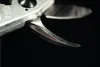 A close-up shot of the blades of a pair of pruning shears against a black background. Náhled obrázku produktu