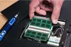 A person is installing RAM modules into a laptop. Produktbild-Vorschau