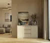A modern living room with a beige sideboard displaying decorative items and artwork.