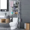 A bathroom scene with a toilet and a shelving unit. Produktbild-Vorschau