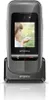 A close-up studio shot of an Emporia ONE mobile phone in its charging cradle, with a picture of a child on the screen. Podgląd zdjęcia produktu