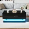 A modern black coffee table with LED lighting in a living room setting. Anteprima dell’immagine prodotto
