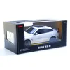 A white Rastar BMW X6 M RC car is displayed inside its retail packaging. Podgląd zdjęcia produktu