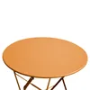 A close-up view of an orange round table with a metal folding base. Voir les images du produit