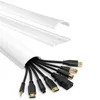 A white PVC cable management channel with various cables emerging from it, shown with a separate, disassembled piece of the channel above. Produktbild-Vorschau