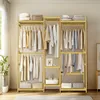 A wooden garment rack filled with clothes and storage bins, set in a room with natural light. Náhled obrázku produktu