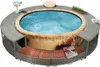 A round whirlpool with a grey rattan surround and wooden seating areas. Náhled obrázku produktu