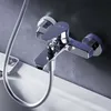 A close-up shot of a chrome bathtub faucet mounted on a dark gray wall, with a white bathtub edge visible in the foreground. Produktbild-Vorschau