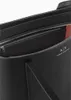 A close-up view of the interior of a black shopper bag, showing a zippered compartment and the Armani Exchange logo. Podgląd zdjęcia produktu