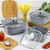 A kitchen scene with cookware, ingredients, and cutting boards. Voir les images du produit