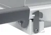 A close-up view of a mechanical latch mechanism on a white and gray device. Náhľad obrázku produktu
