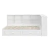 A white bed frame with a bookshelf headboard and drawers underneath, shown against a white background. Produktbild-Vorschau