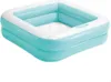 An inflatable square pool with two layers of aqua blue walls and a white top rim. The bottom is white and textured. Produktbild-Vorschau