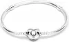 A silver Pandora bracelet with a heart-shaped clasp is displayed on a white background. Anteprima dell’immagine prodotto