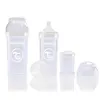 A collection of baby bottles and accessories, including a larger bottle on the left and a smaller bottle with a nipple on the right, along with other components. Produktbild-Vorschau