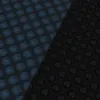 A close-up, diagonal view of a pool solar cover with a pattern of raised circles, split into blue and black sections. Anteprima dell’immagine prodotto