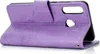 A purple flip case for a Huawei P30 Lite phone, with a mandala pattern embossed on the cover. Produktbild-Vorschau