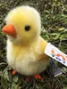 A stuffed chick sits on the ground amongst leaves and twigs. Podgląd zdjęcia produktu