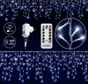 A product image showcasing a string of white LED icicle lights with a remote control and power adapter. Anteprima dell’immagine prodotto