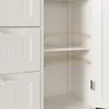An interior view of a white cabinet with shelves and drawers. Náhled obrázku produktu