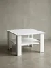 Weißer Couchtisch mit Ablage in der Frontansicht. Der kompakte Kaffeetisch misst 60x42x60 cm und überzeugt durch sein minimalistisches Design mit vier stabilen, flachen Beinen._#sku_BARWL5.834#
