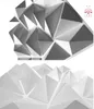 A collage of two images showing abstract geometric wall panels in white and gray. Náhled obrázku produktu