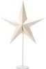 A white star-shaped lamp on a white stand against a white background. Náhled obrázku produktu