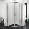 A modern shower enclosure in a bathroom setting with white tiled walls and black tiled floor. Podgląd zdjęcia produktu