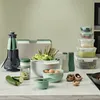 A collection of kitchenware, including a cutting board set, salad spinner, storage containers, and utensils, arranged on a countertop. Anteprima dell’immagine prodotto