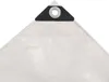 A close-up view of the corner of a white tarp with a reinforced grommet. Náhľad obrázku produktu