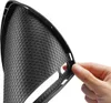 A hand is holding a black phone case with a honeycomb pattern. Podgląd zdjęcia produktu