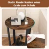 A round side table with a rustic brown wood top and black metal legs, decorated with a photo frame and a diffuser. Náhled obrázku produktu