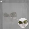 A close-up of a grey mesh fabric with a circular inset showing two potted plants. Produktbild-Vorschau