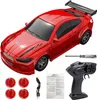 A red remote control drift car with accessories laid out around it. Náhled obrázku produktu